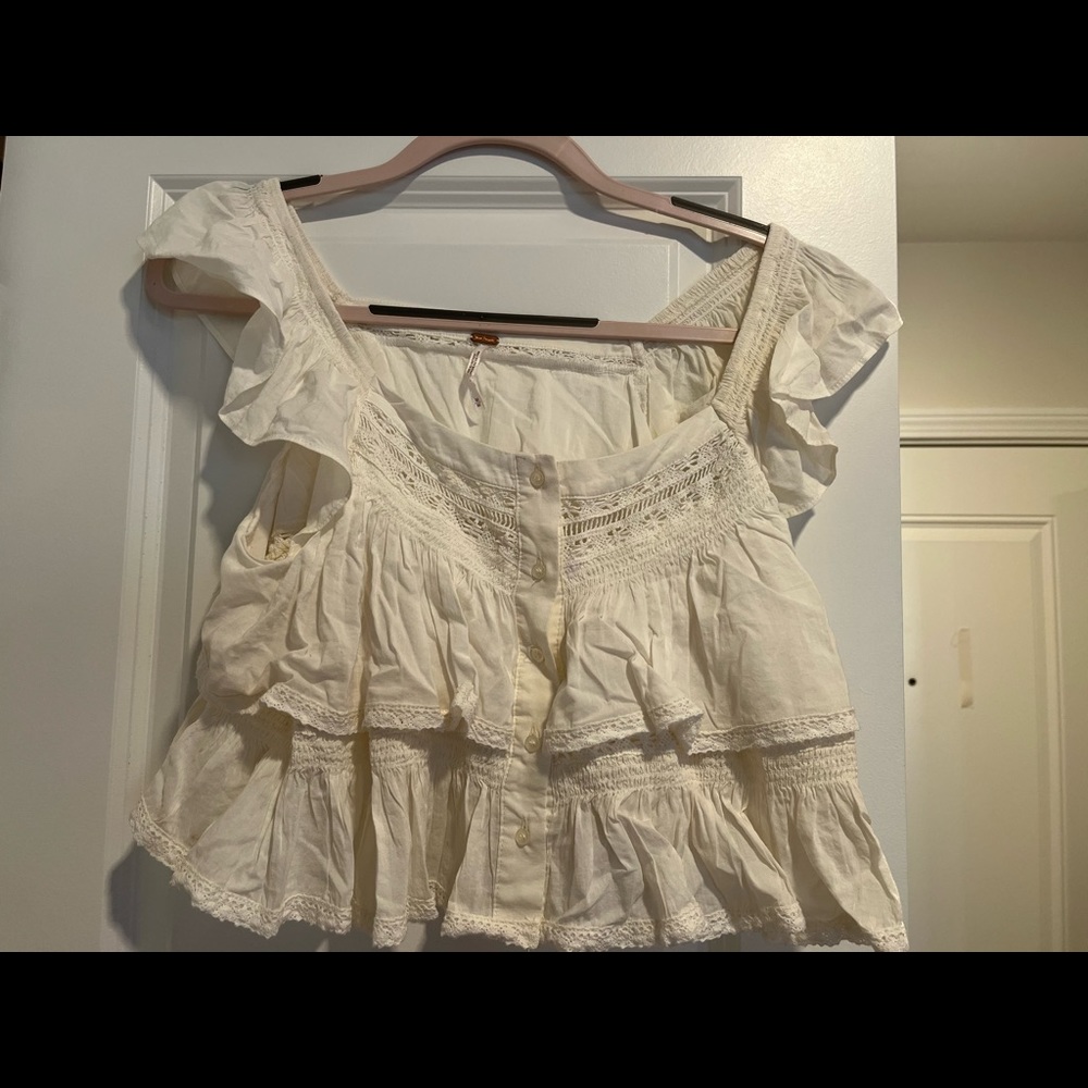 Free People white top. Size M. Never worn.  Perfect condition.